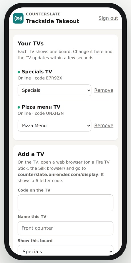 Counterslate setup page on a phone listing two TVs, Specials TV and Pizza menu TV, both online, each with a board picker.